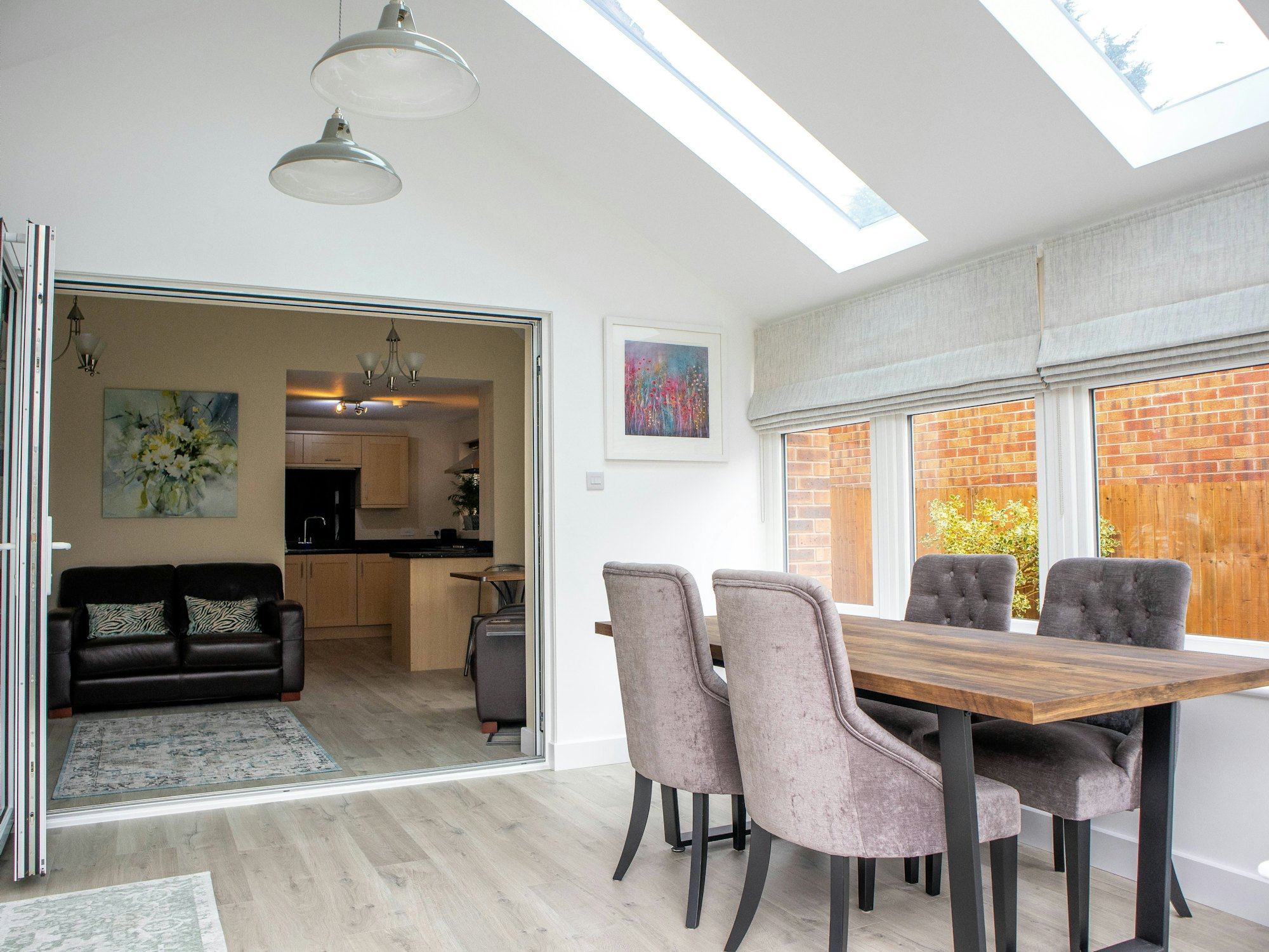 Interior dining room with skylights in a vaulted ceiling